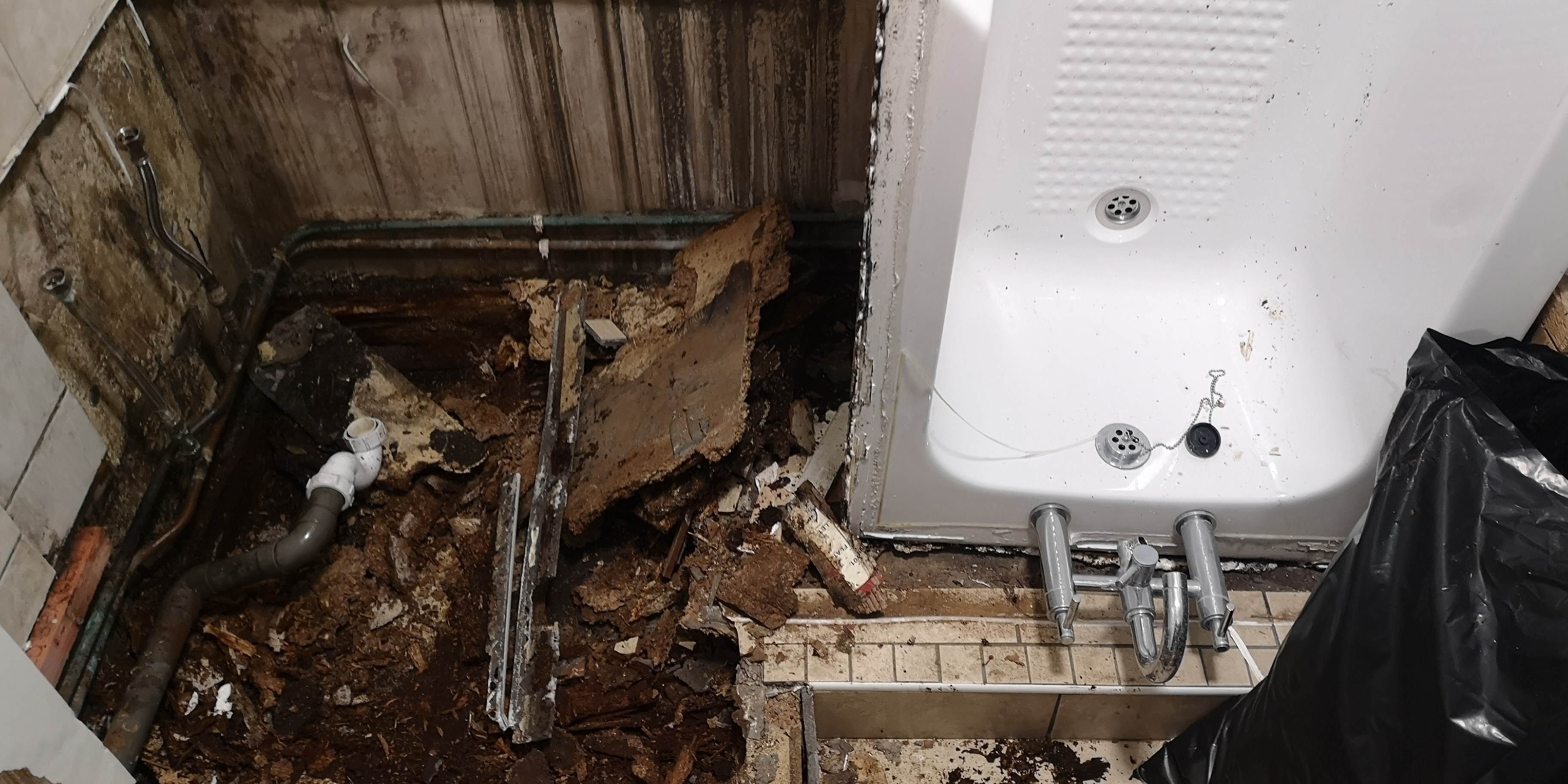 Excessive water damage under a bath