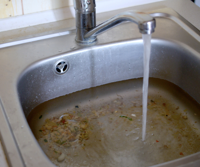 Blocked sink, slow draining water